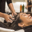 © Svetlanamax - Spa worker applying hair treatment at salon wash station