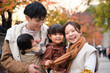 © Westend61 - Smiling family with children enjoying autumn together outdoors in Tokyo