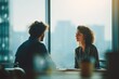 © doomu - Meeting Between a Manager and Employee to Discuss Performance at a High-Rise Office During the Daytime