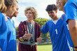 © Rido - Sport coach giving motivation to young players