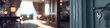 © Jhati - A key hangs from a door handle in a blurred luxurious interior background