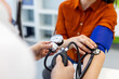 © Graphicroyalty - Close up of doctor checking blood pressure with manual gauge and stethoscope. Professional medical examination for hypertension and cardiovascular health monitoring in modern clinic.