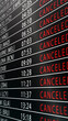 © DBFilms - Vertical airport flight information display filled with canceled routes, highlighting large scale travel disruption, airline crisis, operational failure, and global transportation stress.