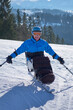 © Alex - a skier in a blue jacket poses