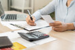 © KMPZZZ - Deduction planning, debt asian young woman calculating money balance of finance from bill and income, cost budget expenses for pay money form personal individual on table at home. Financial concept.