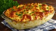 © Plaifah - Creamy Baked Pasta Dish Topped with Golden Cheese Crust and Fresh Herbs Served in Glass Casserole on Rustic Wooden Table