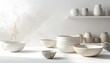 © eliyashevskiy - Ceramic bowls and jars arranged on a table with a light background showing a simple aesthetic in a well-lit space