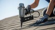 © Ronald Red - Woman roofer installing shingles on a roof with a pneumatic nailer. Construction woman working in residential building trade.