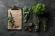 © Kiara - Frische Küchenkräuter  - Flat Lay mit Klemmbrett auf dunklem Steinuntergrund