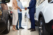 © Prostock-studio - Unrecognizable Car Seller Shaking Hands With Buyers Couple After Successful Deal, Cropped Shot Of Black Salesman Selling New Vehicle To Customers In Dealership Center, Handshaking After Agreement