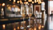 © Abdul - Two champagne flutes on a bar counter