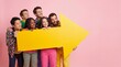 © Yauhen - Diverse group of smiling young people holding large yellow arrow pointing right on pink background. Cheerful team looking aside, ideal for advertising, promotions and directing attention.