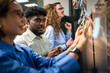 © Miljan Živković - Diverse business team collaborating during brainstorming session in office