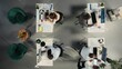 © DC Studio - Top down view of business people consulting on budgeting and resource allocation during corporate event. Multinational company work team analyzes data for partnership and strategic planning.