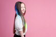 © New Africa - Cute girl with bright clip-in hair extensions on pink background. Space for text