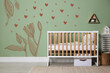 © New Africa - Child's room with furniture and image of hearts and plants on wall. Cute interior design