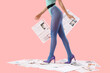 © Pixel-Shot - Young woman in bodysuit with many newspapers on pink background, closeup