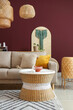 © Pixel-Shot - Interior of stylish living room with cozy grey sofa, coffee table and wicker lamps