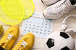 © Pixel-Shot - Composition with calendar, sports, equipment and shoes on light wooden background