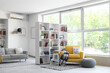 © Pixel-Shot - Interior of stylish living room with yellow armchair, pouf and bookshelf