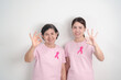 © Jo Panuwat D - Couple woman with pink Ribbon for Pink October Breast Cancer Awareness month, May Women Health, November Birth Parents Adoption, women rights, Empowerment, March International Women day and Cancer day