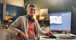 © WesJVR/peopleimages.com - Happy man, portrait and night with video editor on computer for digital marketing in office. Male people, creative or designer working late with smile on technology for UI development or app design