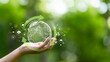 © Anon - hand holding digital earth with circular economy concept. renewable energy, resource efficiency, waste reduction, ESG strategy, SDGs, and sustainable environment green business innovation.