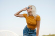 © VISTA by Westend61 - Hipster with sunglasses in casual clothes posing outdoors in urban setting