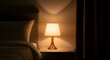 © Agus - Warm, inviting glow from a stylish bedside lamp illuminates a tranquil bedroom setting, fostering a serene atmosphere perfect for winding down and peaceful slumber