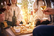 © Lustre Art Group  - Wine tasting table with snacks and people socializing indoors. Concept of home wine tasting, beverage marketing, lifestyle content, hospitality advertising, and relaxed social interaction.