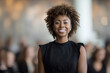 © Andrii Zastrozhnov - Smiling african female adult in black dress in blurred background