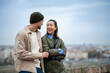 © Zoran Jesic - Smiling couple enjoying city view talking together