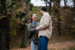 © Zoran Jesic - Happy couple laughing together in autumn park outdoors