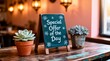 © mihrzn - A chalkboard sign reading 'Special Offer of the Day' is displayed on a rustic wooden table between two potted succulents, set against warm interior lighting.