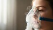 © Nataly - Child receiving respiratory nebulizer treatment with a medical mask. Young patient inhaling vapor for breathing illness. Healthcare concept with copy space