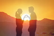 © kieferpix - Couple Forming Heart Shape at Sunset, Valentines Day love concept