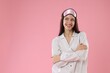 © New Africa - Beautiful woman wearing sleeping mask and stylish pajamas on pink background. Space for text