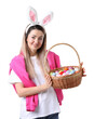 © New Africa - Easter celebration. Smiling woman in headband with bunny ears and wicker basket full of painted eggs on white background