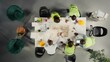 © DC Studio - Top down view of doctors team in a collaborative meeting discussing therapy, diagnostics and clinical coordination. Modern healthcare staff focuses on communication and patient health.