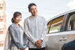 © buritora - A young Asian male salesman serving a couple who came to buy, appraise and purchase a car