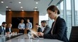© Flatlay Pro - Businesswoman Working on Tablet During Corporate Meeting.