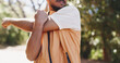© Azeemud25/peopleimages.com - Outdoor, fitness and stretching with hands for hiking, warm up routine and prepare for trekking exercise. Getting ready, wellness practice and person with workout for health, nature training or bokeh
