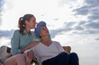 © APchanel - Moment friend support resilience and compassion, often associated with of battling cancer wearing a headscarf a common symbol of strength among cancer patients undergoing treatment.