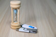 © kawa_xxx - Wooden hourglass and USB flash drives on wooden desk background