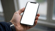 © PixelOriel - Smartphone mockup held by person indoors showing blank white screen for content presentation display template