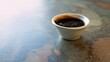 © studio clever - Hoisin sauce in a small ceramic bowl on a kitchen counter. Generative AI