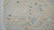 © @ak - Gray brick wall with triangle pattern and green accents