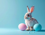 Wielkanocne, niebieskie, minimalistyczne tło z zającem i pisankami