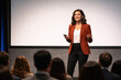© Jeannette - Confident Businesswoman Presenting at a Corporate Seminar or Conference Event