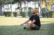 © onderortel - Man Meditating on Grass in a Park. Outdoor Meditation by a Man in a Green Park. Peaceful Meditation Session in Urban Park. Man Sitting on Grass Meditating Outdoors.